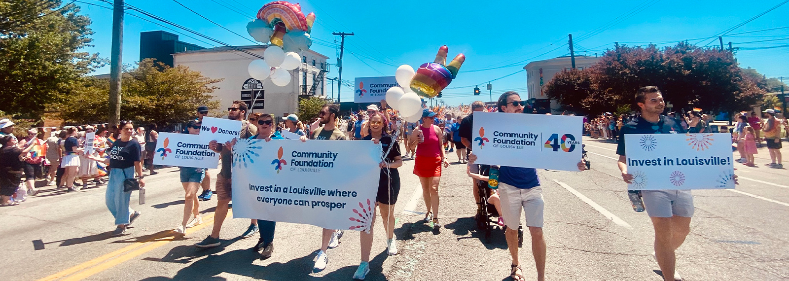 Pictured are Community Foundation of Louisville staff walking in Pride Parade 2024